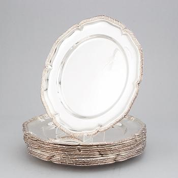 A set of twelve rococo-style silver plates, mark of GAB, Stockholm 1947.