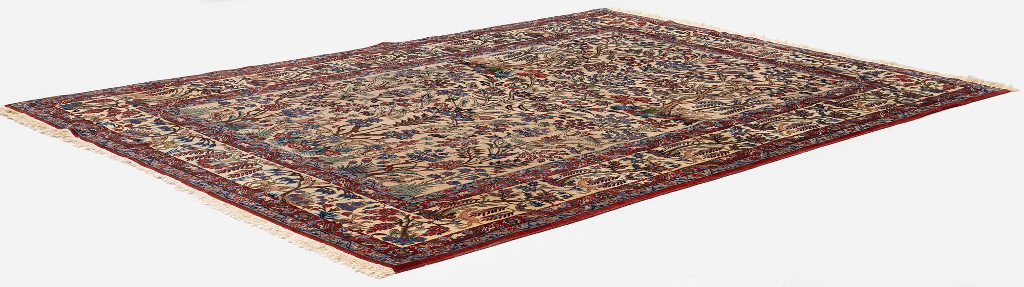 A semi-antique Qum carpet, Central Persia, c. 312 x 215 cm.