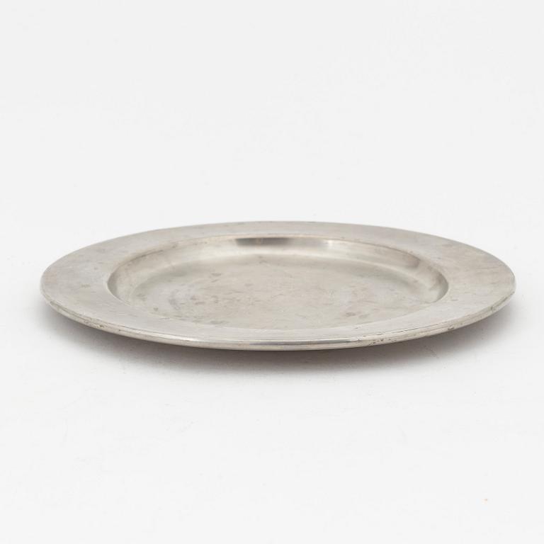 Five pewter plates, of which four Firma Svenskt Tenn, Stockholm.