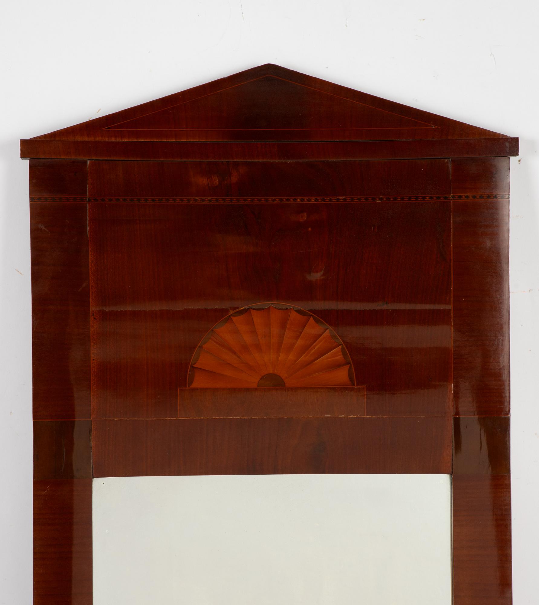 An Empire mirror, first half of the 19th Century.