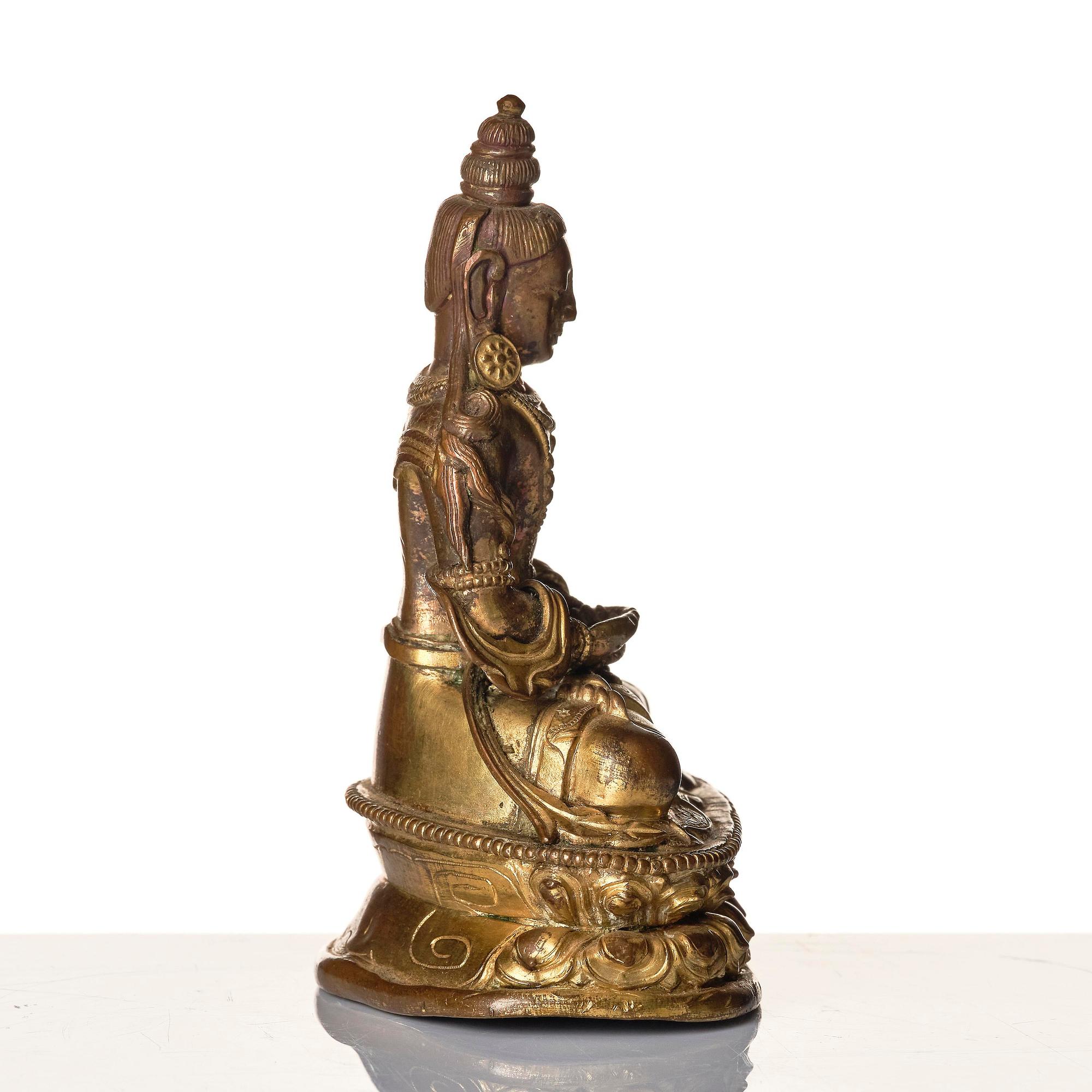 A gilt copper alloy figure of Amitayus, Tibeto-Chinese/Mongolia, 18th century.