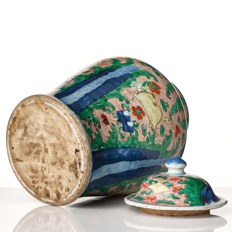 A pair of Transitional Wucai jars, 17th Century.