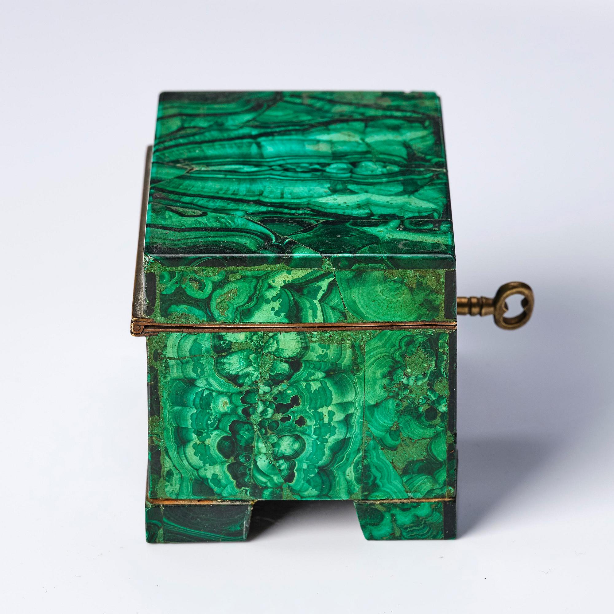 A Russian Nicolas II malachite-veneered box, circa 1900.