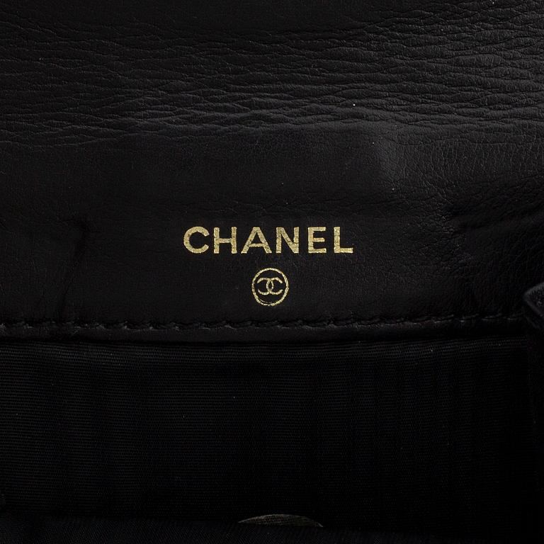 CHANEL, a caviar leather wallet.