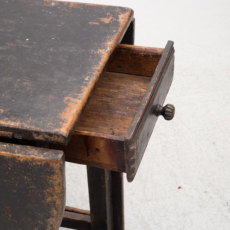 A Swedish wooden table, 19th century.