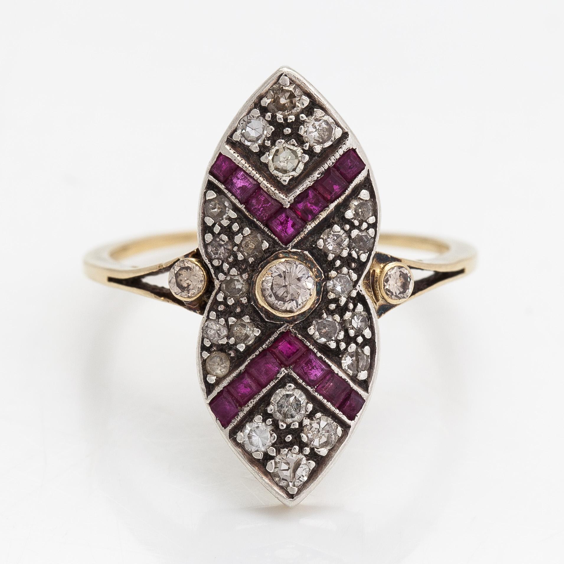 An 18K gold ring, brilliant- and single cut diamonds ca- 0.43 ct in total and rubies.