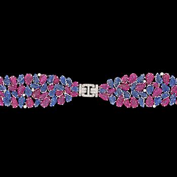 985. A carved ruby, blue sapphire and diamond bracelet.
