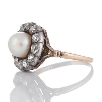 A pearl ring set with old-cut diamonds.