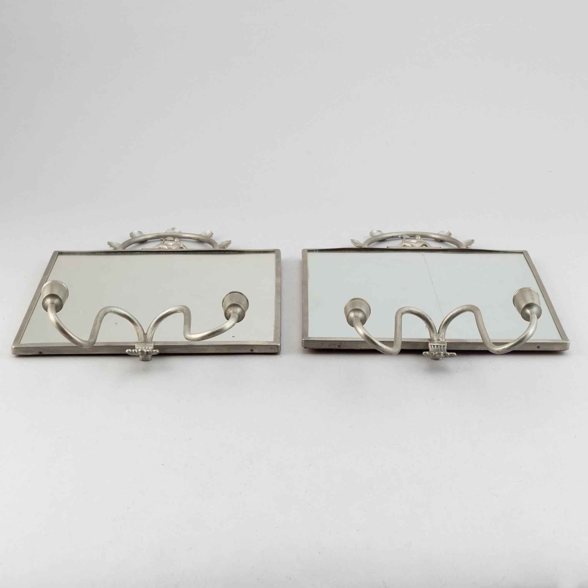 Two pewter wall sconces from Firma Svenskt Tenn, 1925.