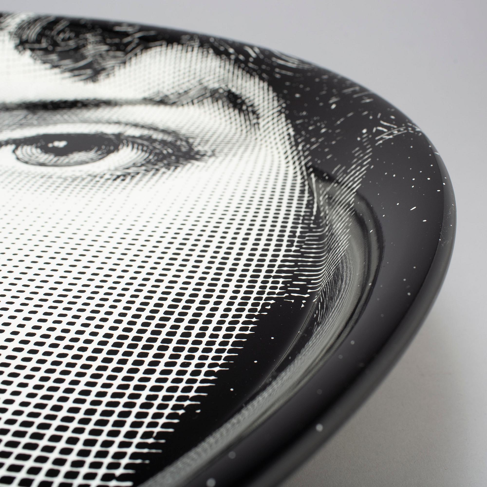 PIERO FORNASETTI, a tin tray, numbered 27, dated 2013.
