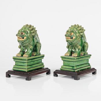 A pair of green glazed figures of mythical beasts, Ming style, China, 20th Century.