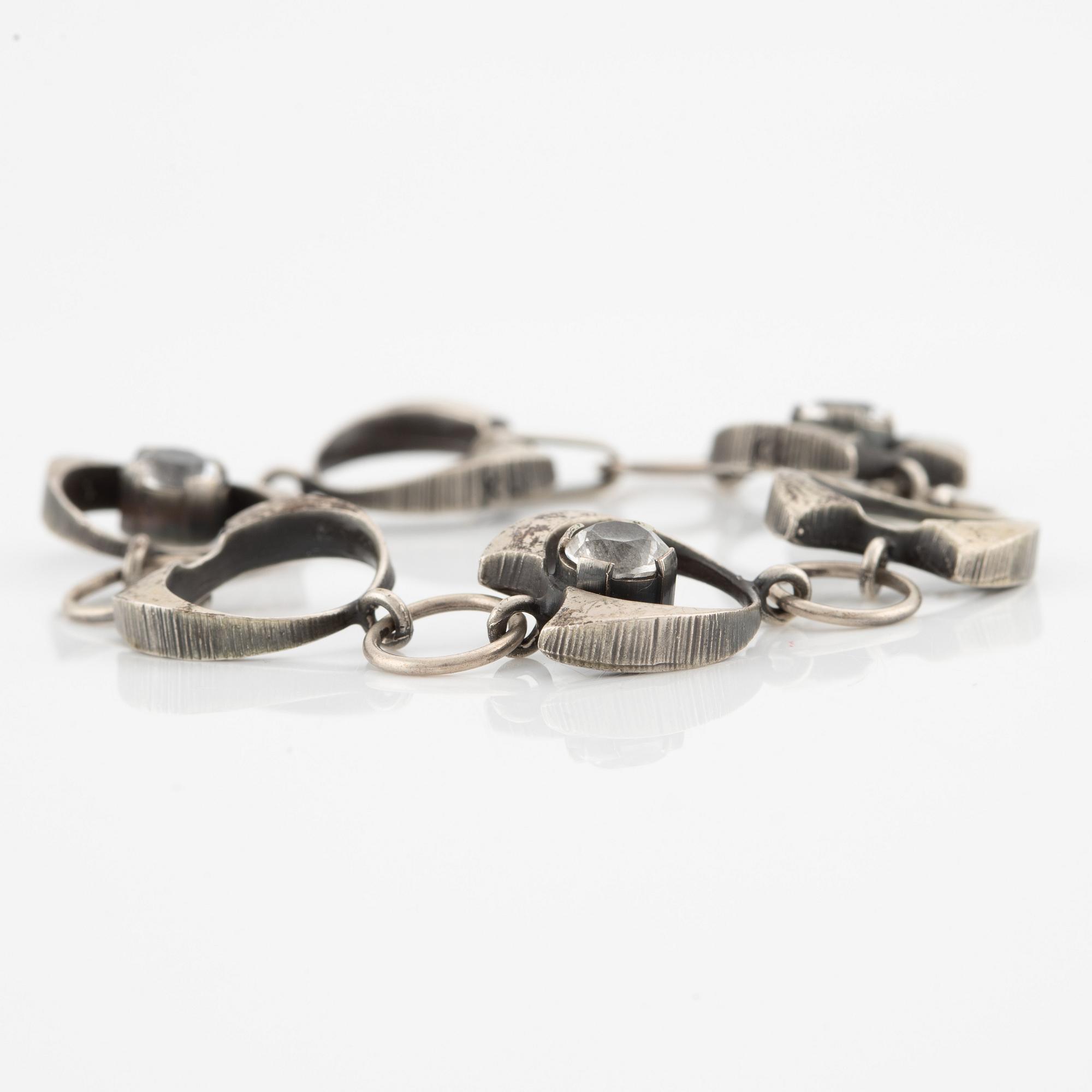 Karl Laine, ring, pendant, and bracelet, silver with rock crystal.
