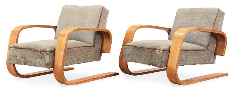 A pair of Alvar Aalto 'no 400' birch armchairs, O.y Huonekalu-ja Rakennustyötehdas A.B for Artek, Finland ca 1939.