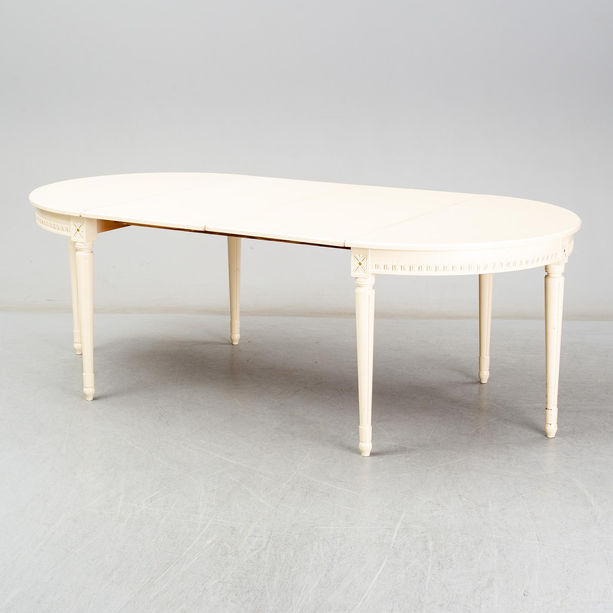 A Gustavian style dining table, second half of the 20th century. 3 leaves included.