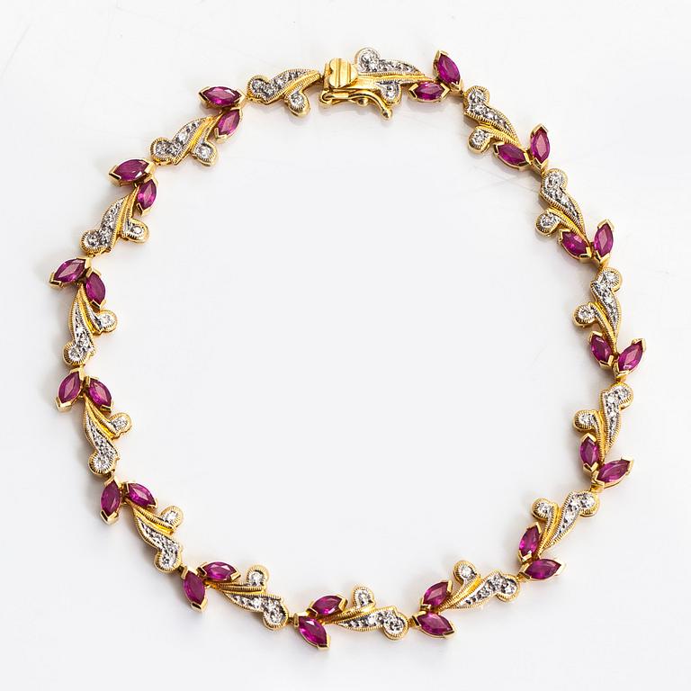 An 18K gold bracelet, with diamonds and rubies.