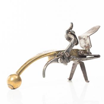 A Northern European flintlock lighter, mid 18th century.