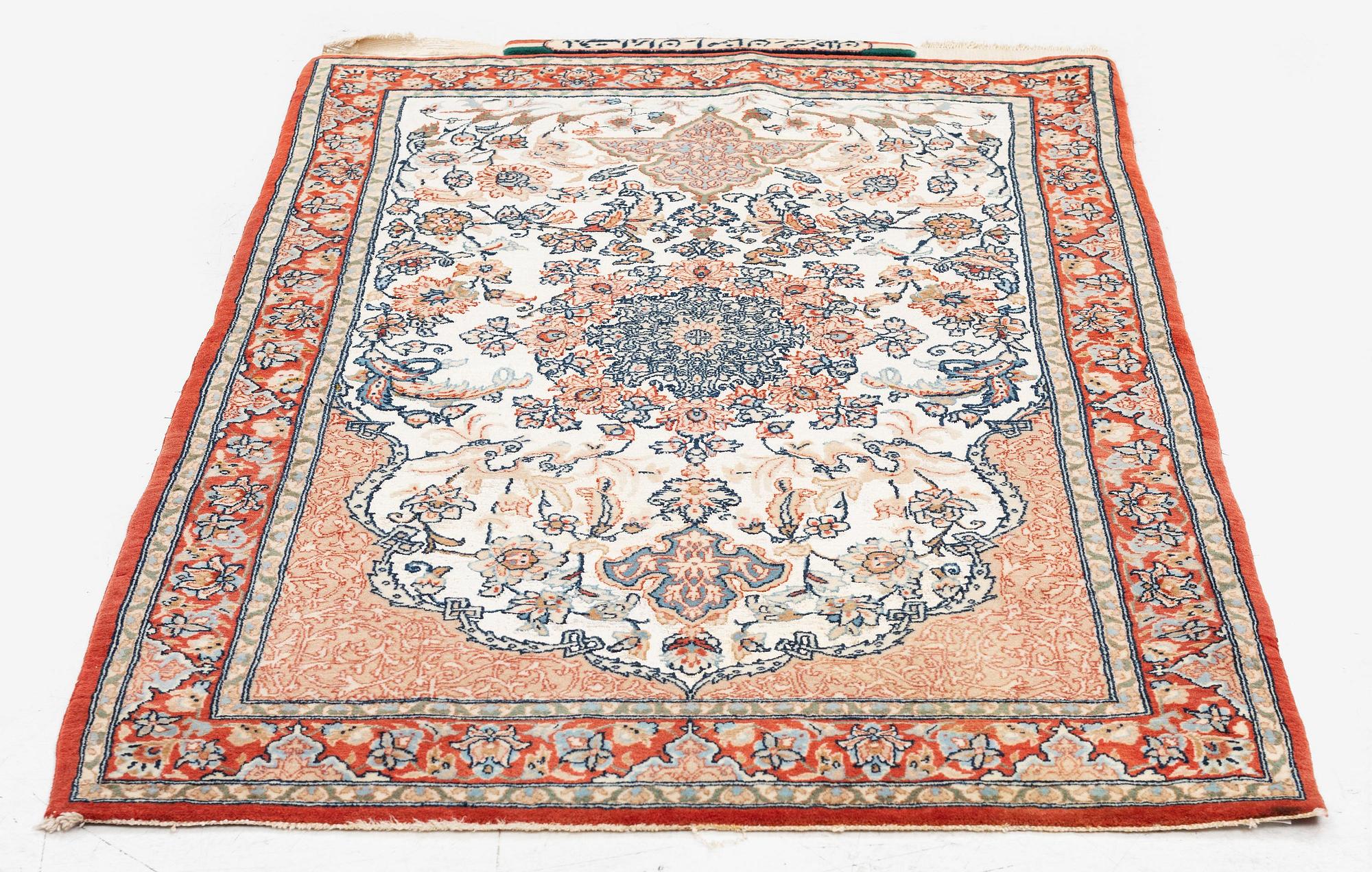 A semi-antique Isfahan rug, central Iran, part silk, signed (Mohammed) Seirafian, c. 120 x 70 cm.