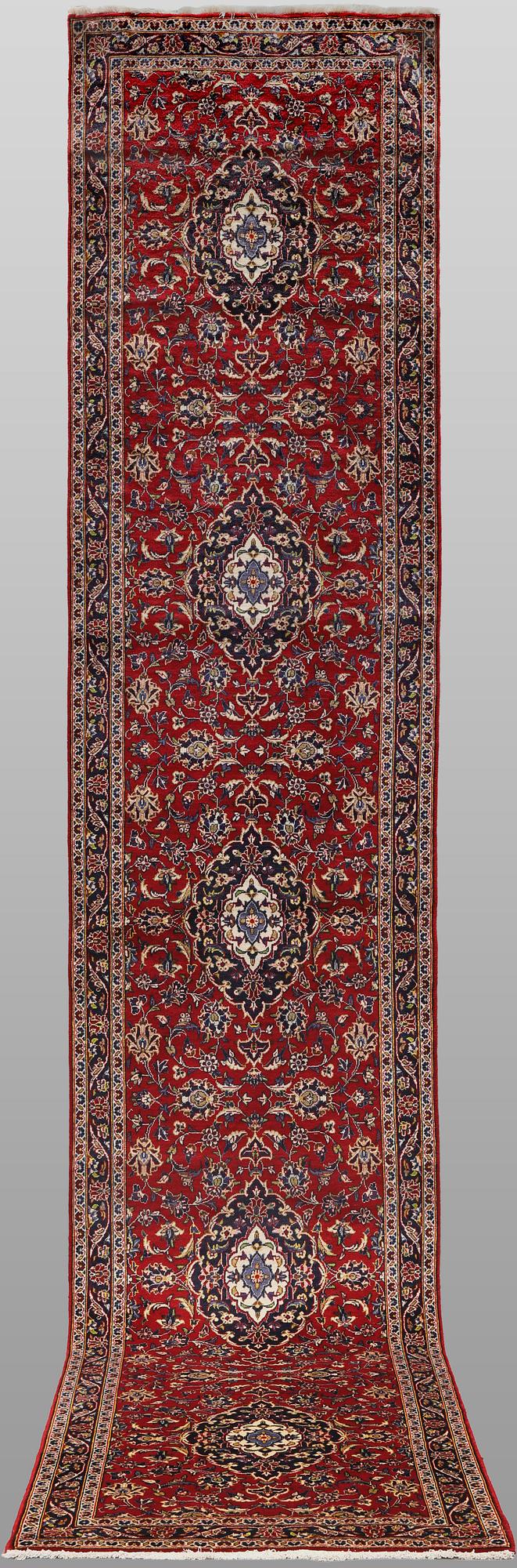 A Keshan runner carpet, 587 x 95 cm.