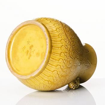 A yellow glazed phoenix vase,  Qing dynasty, with a Kangxi mark.