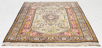 A silk Gohm rug. a 166 x 105 cm.