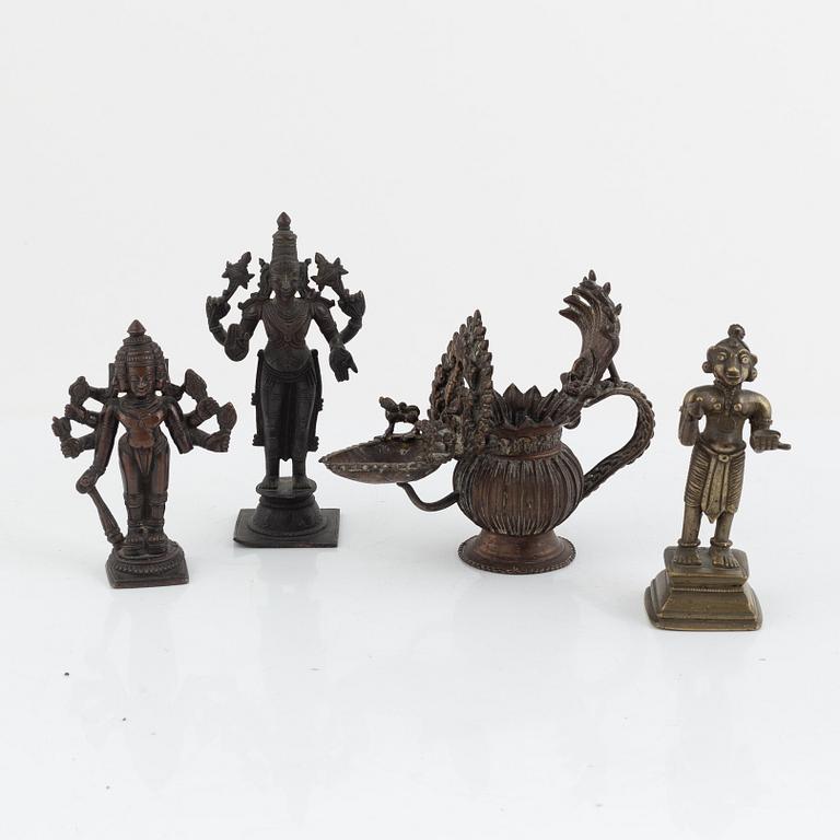 A group of three Indian bronze figures and an ewer, 20th century.