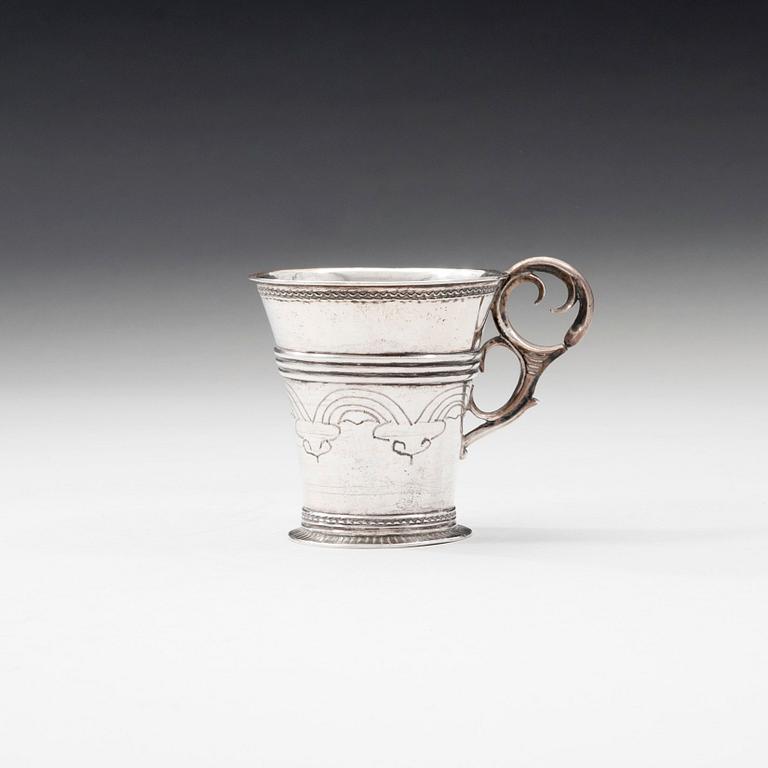 A CUP WITH HANDLE.