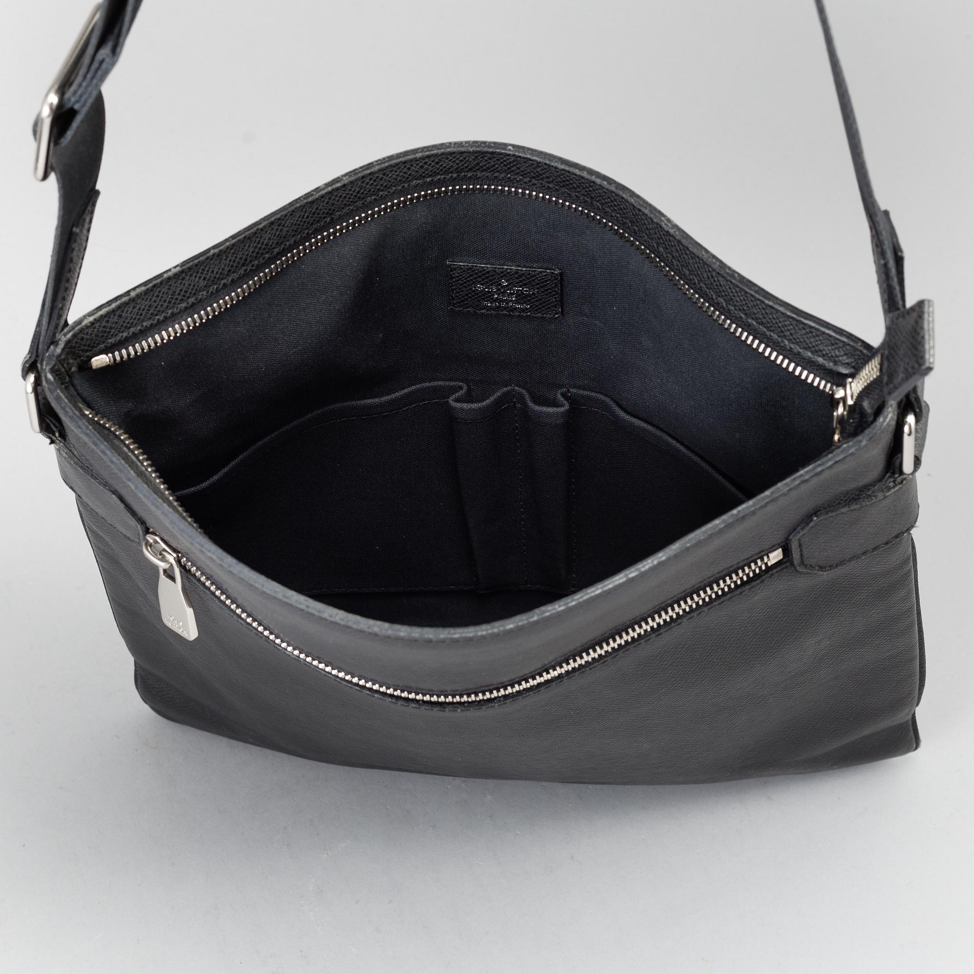 LOUIS VUITTON, a black Taiga bag, 2012.