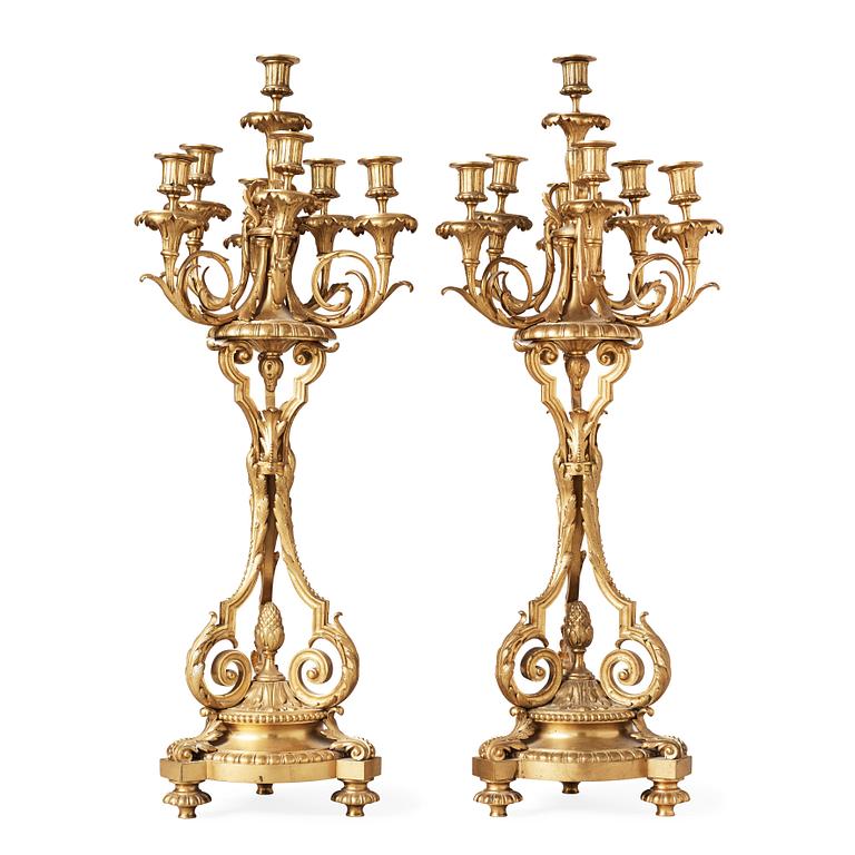 A pair of Louis XVI-style circa 1900 seven-light candelabra.