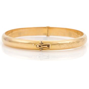 An 18K gold bangle. Ø 62 mm. Weight 12 gr.