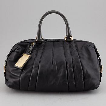 DOLCE & GABBANA, a black leather bag.