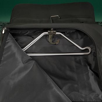 A Garment bag by Louis Vuitton.