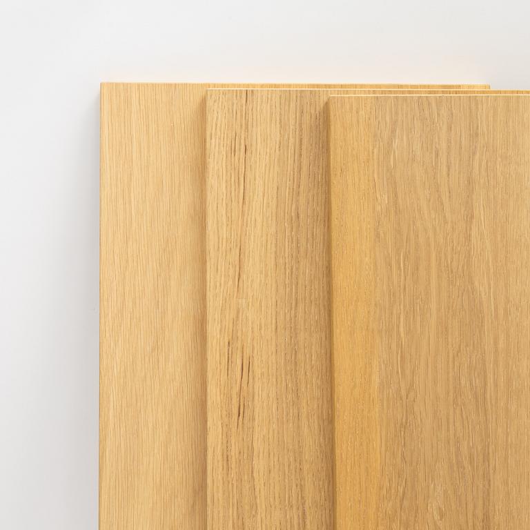 A 'String' shelving system by Nils Strinning, with three sides and 12 shelves.