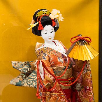 Four late 20th century Japanese dolls.