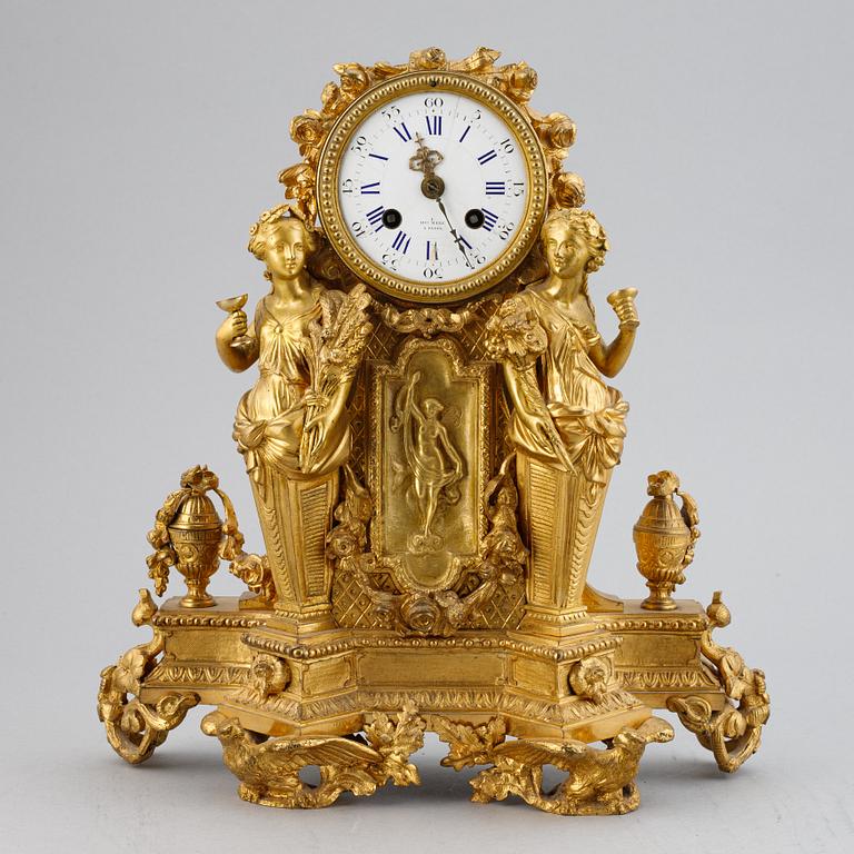 A French gilt bronze mantel clock from Henry Marc á Paris, second half of the 19th century.