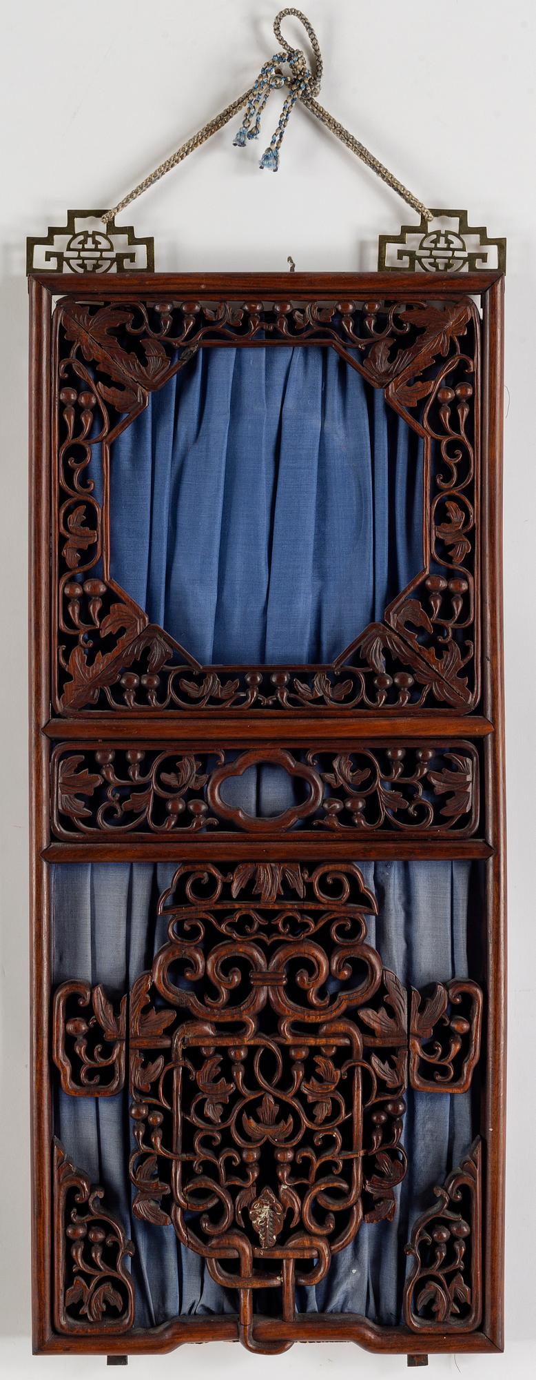 A Chinese carved hardwood panel/window, 20th century.