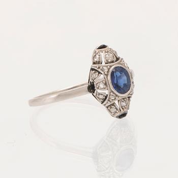 Art Deco platinum ring with an oval faceted sapphire and old-cut and rose-cut diamonds.