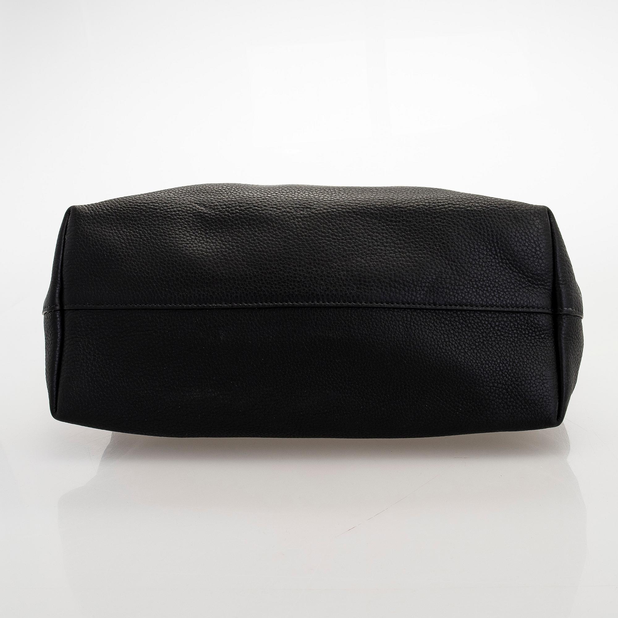 Prada, A 'Vitello Daino Tote' bag.