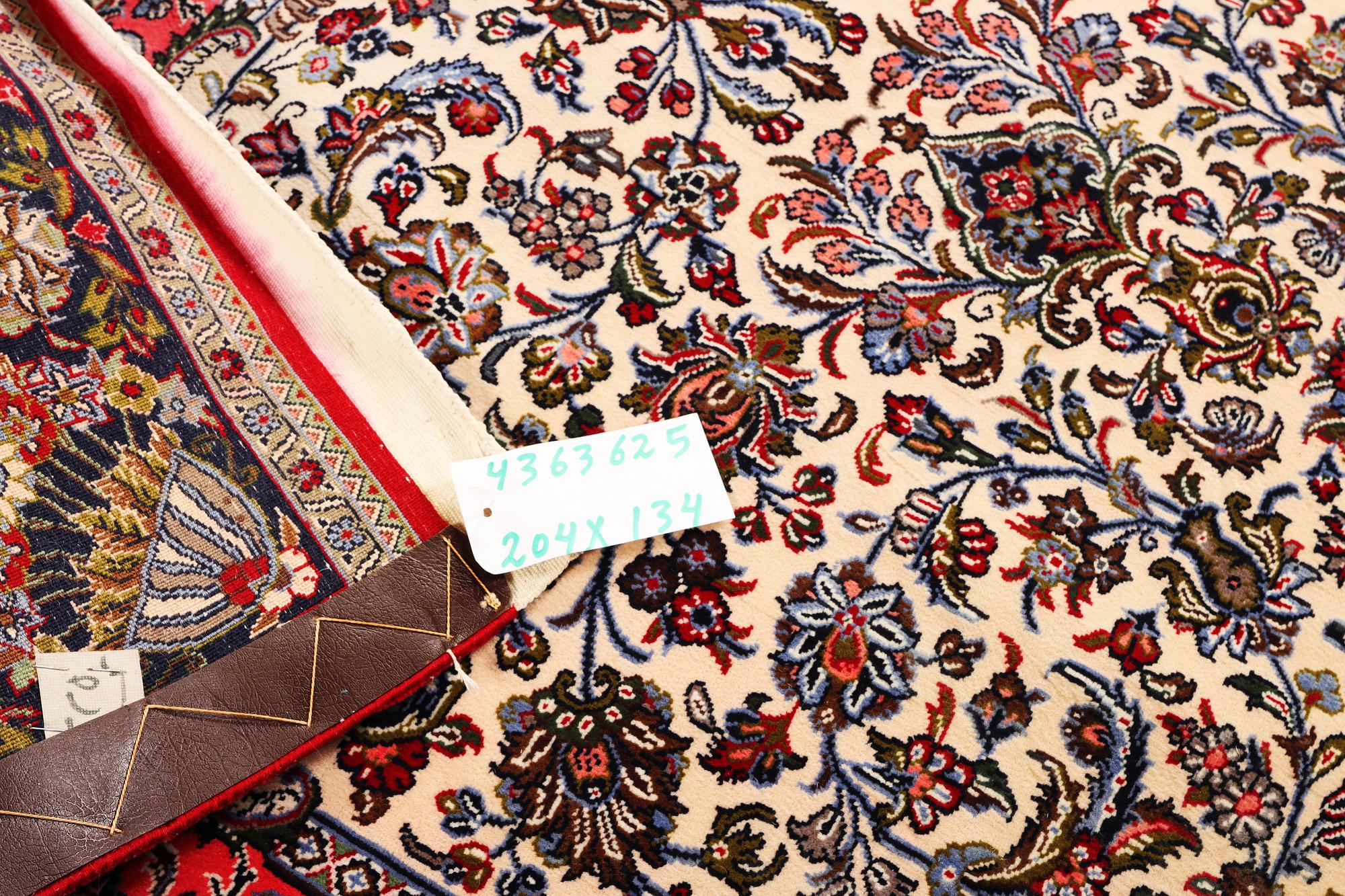 A Quum rug, c. 204 x 134 cm.