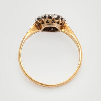 An 18K gold ring with old-cut diamonds.