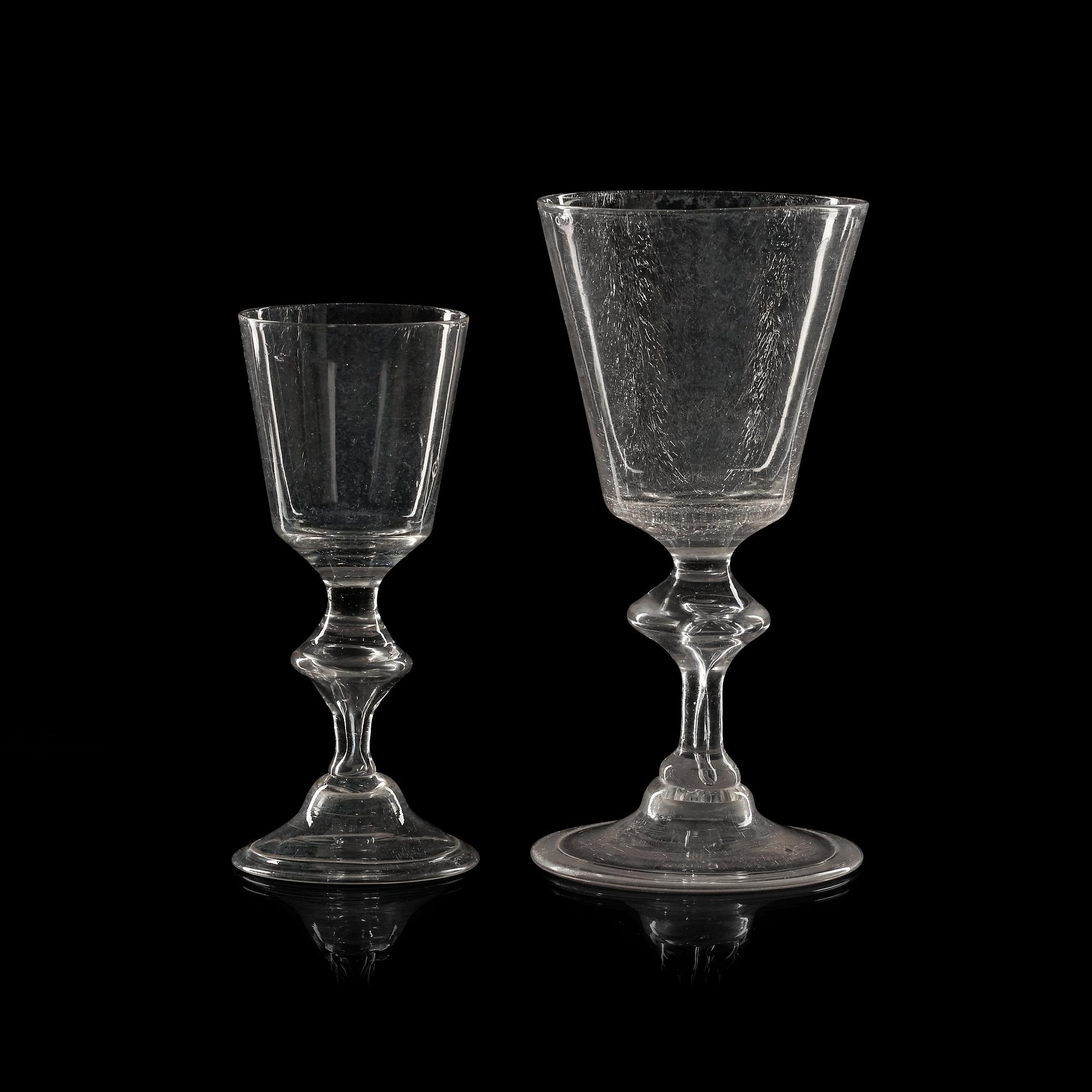 A set of 16 wine glasses and 11 smaller wine glasses, the latter part of 18th Century.