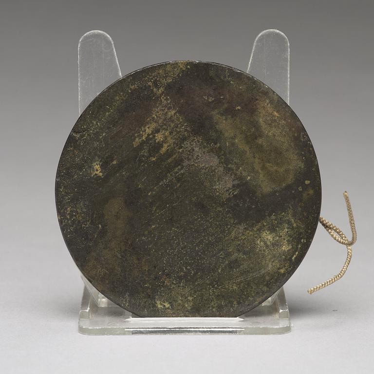 A bronze mirror, Han/Jin dynasty 3rd-4th Century.