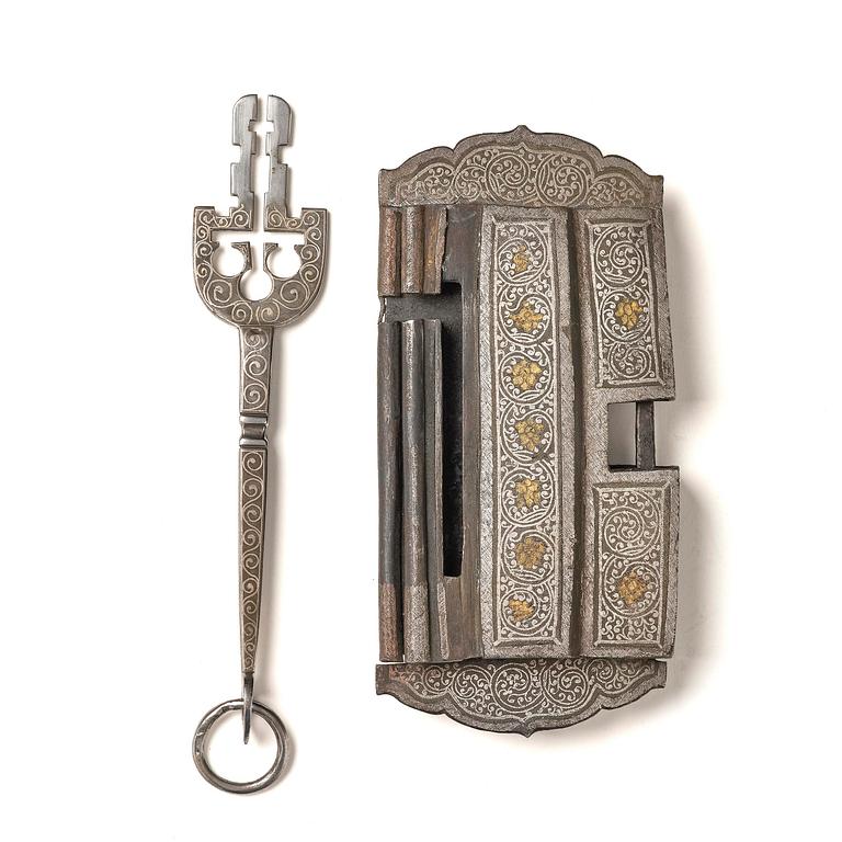 A Shokpa-shaped lock, inlaid with silver threads, Tibet, 19th century. 'Ashtamangala'.