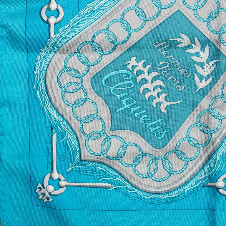 Hermès, a 'Cliquetis' silk scarf.