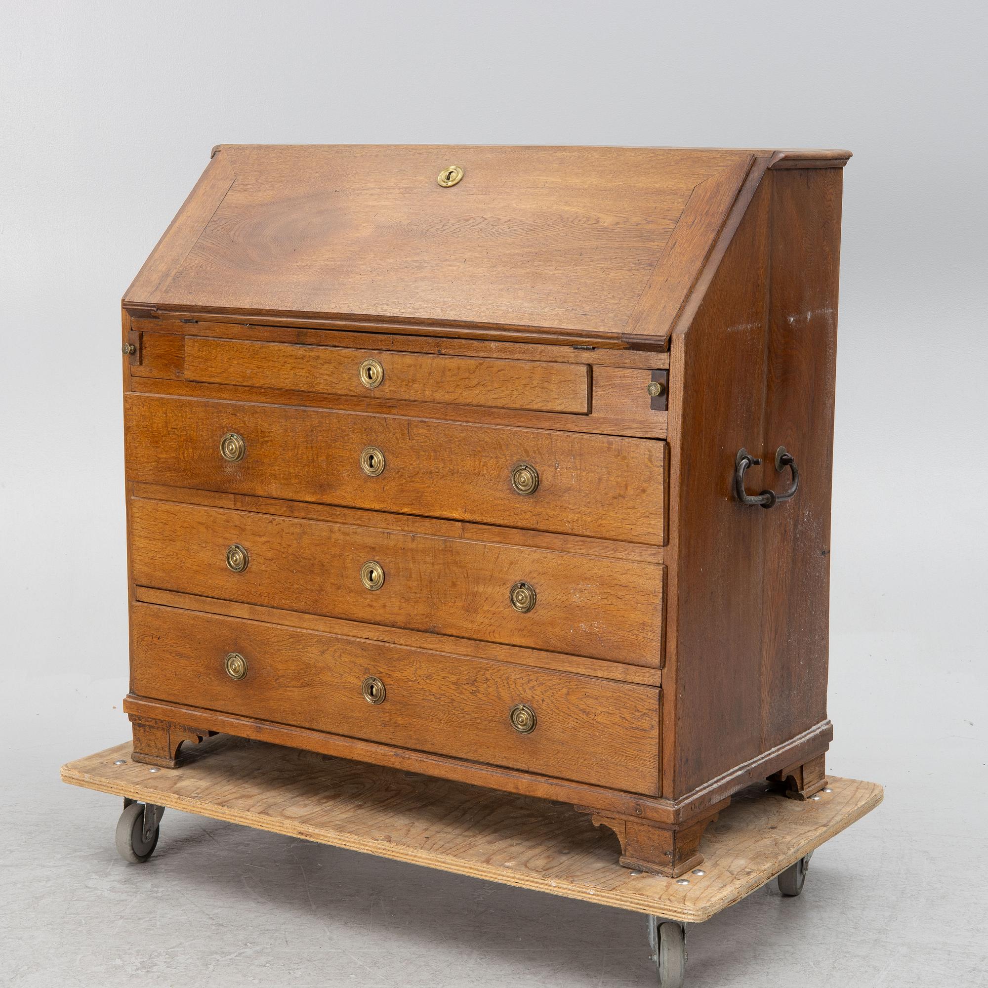 An oak secretaire, around 1800.