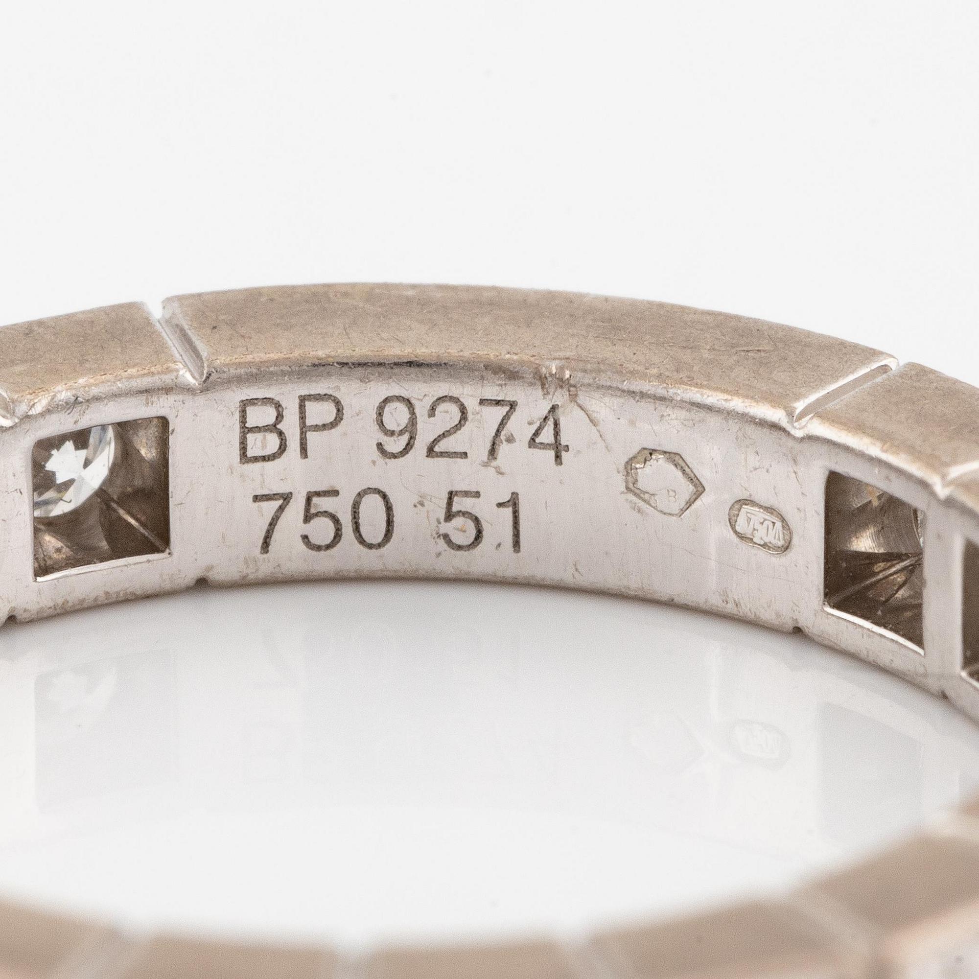 An 18K white gold Cartier ring set with round brilliant-cut diamonds.
