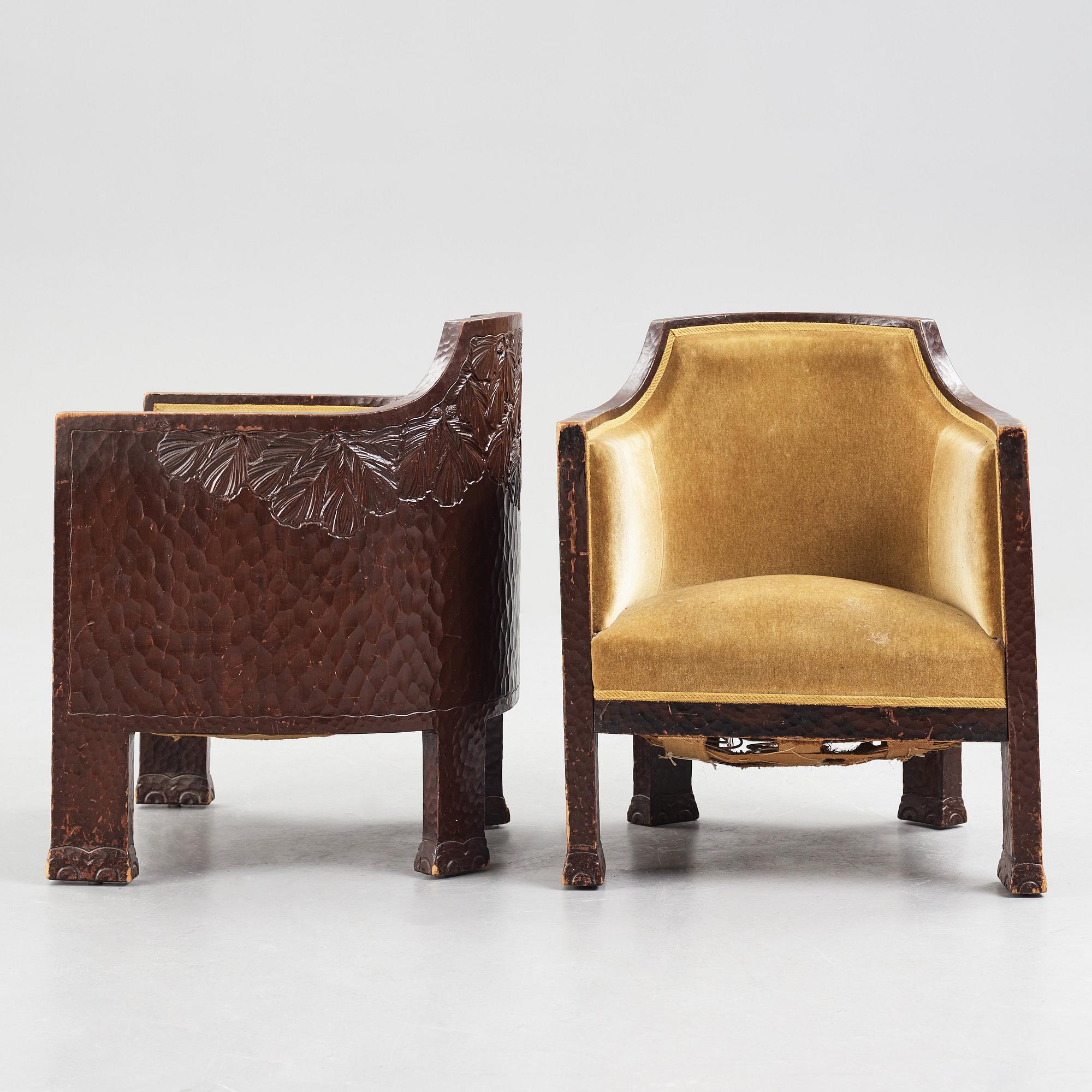 Otto Wretling, attributed to, a pair of Art Nouveau carved pine easy chairs,