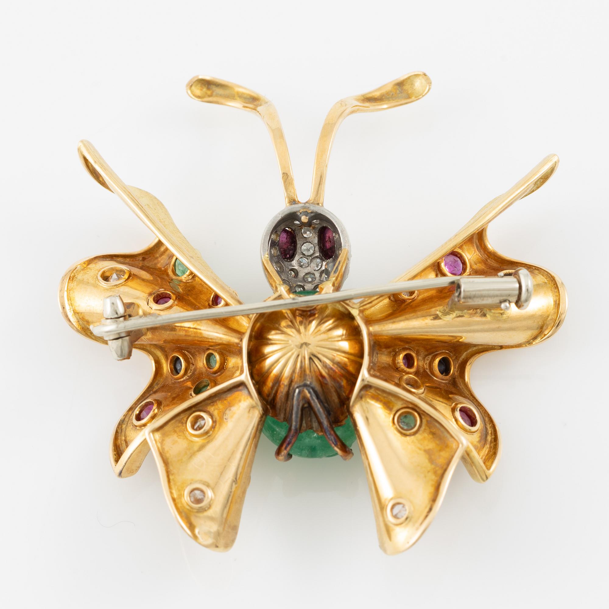 Brooch in the form of a butterfly, 14K gold with carved emerald, sapphires, emeralds, rubies, and diamonds. Second half of the 20th century.