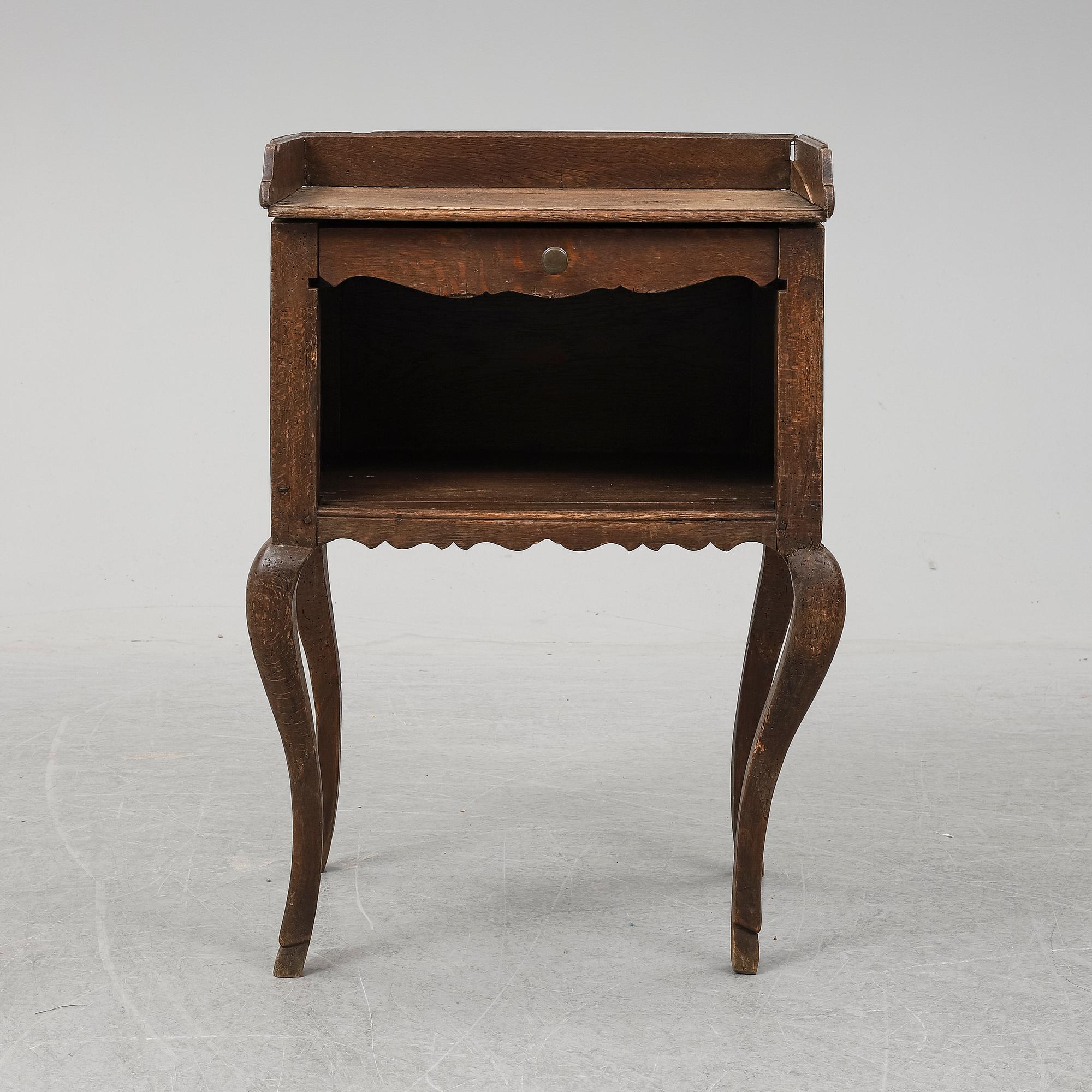 A mid 18th Century oak rococo bedside table.