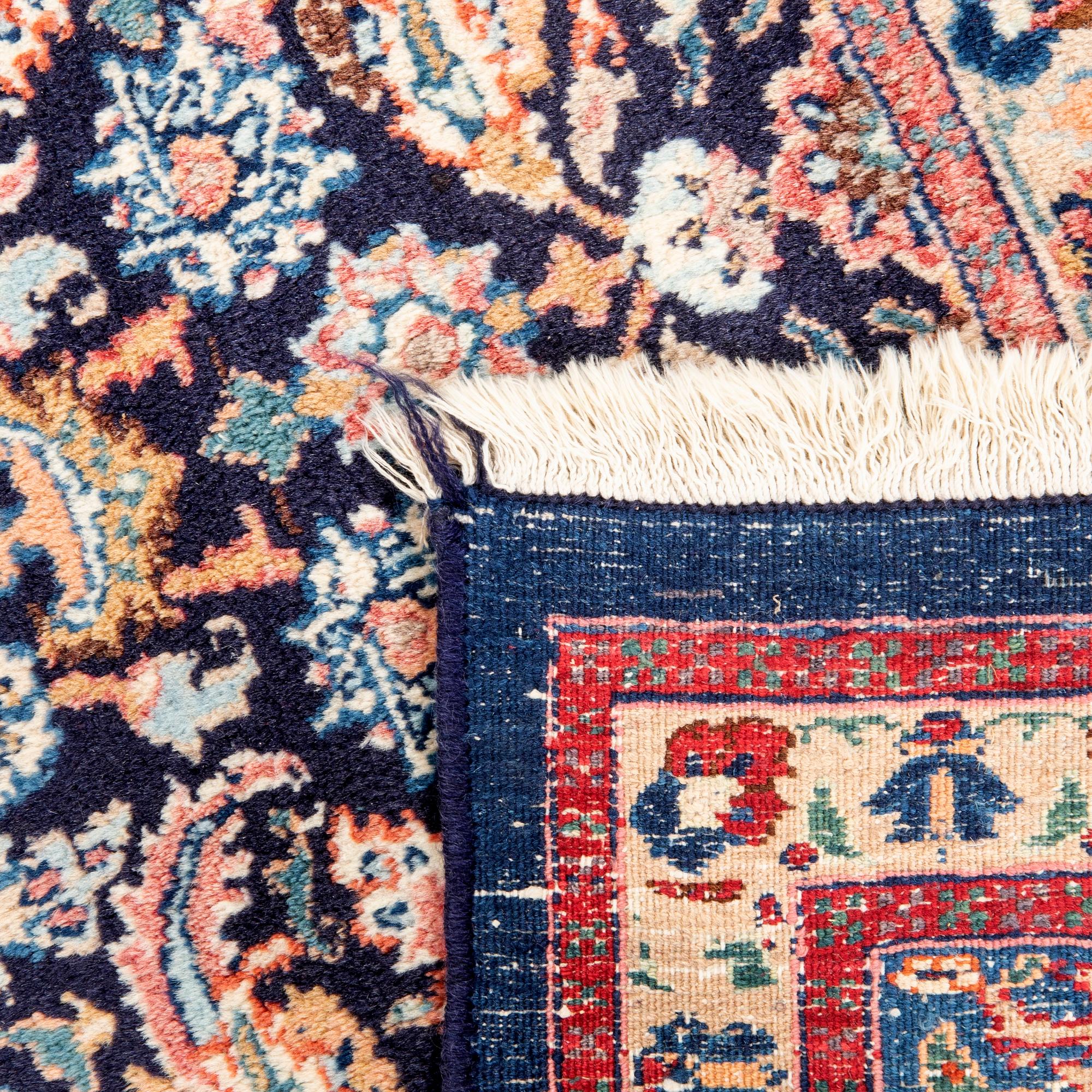 A semiantique Mashad carpet approx 320x220 cm.