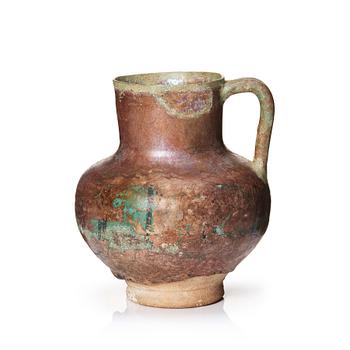 336. A 12-13th century turquoise and black underglazed jug.